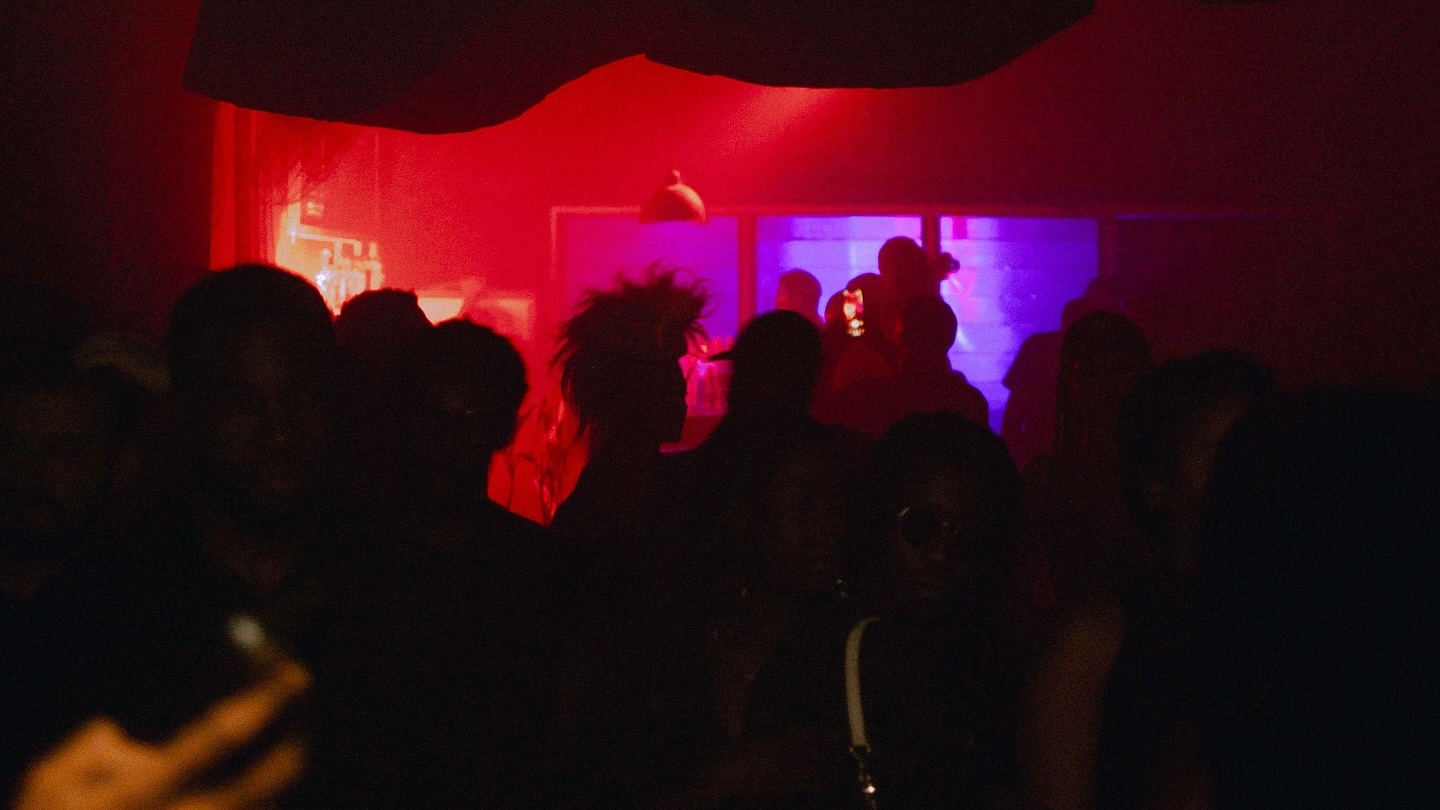 Intimate dancefloor crowd at an Accra night gathering